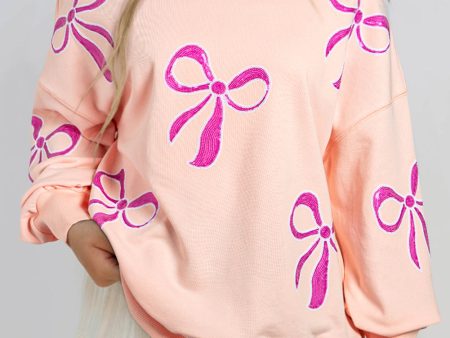 Apricot Pink Sequined Bowknot Drop Shoulder Oversized Sweatshirt Online